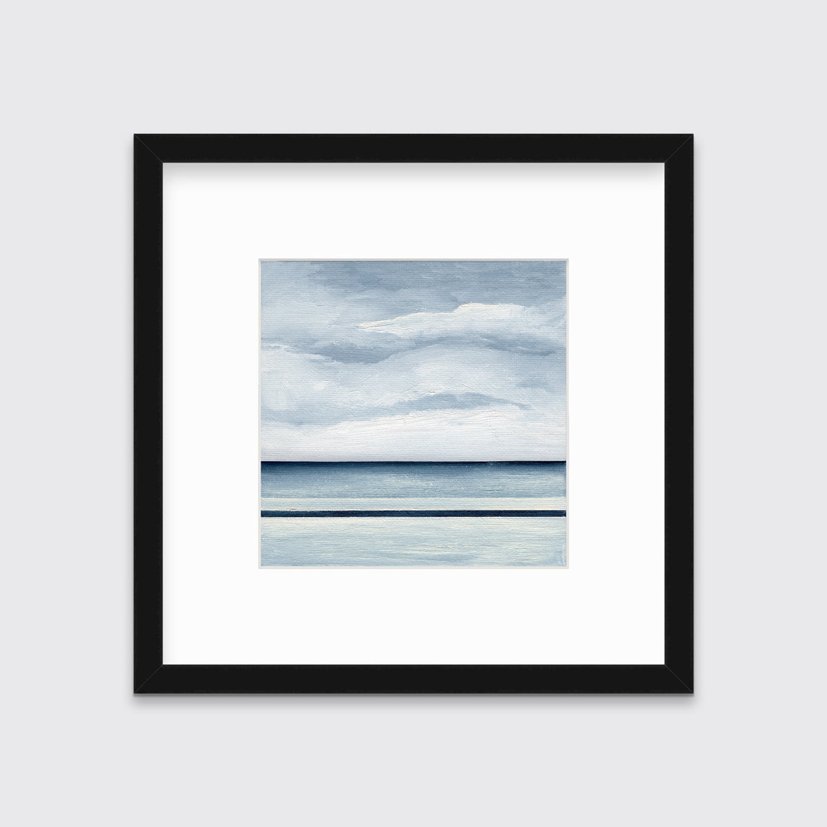 A blue and white abstract linear landscape in a black frame with a mat hangs on a white wall.