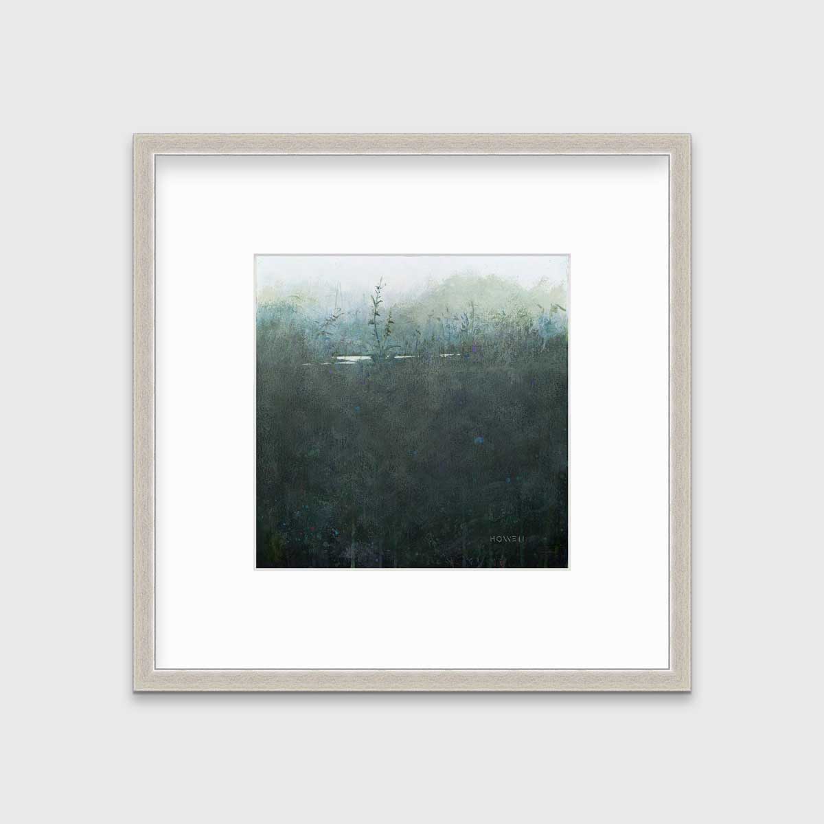 A dark muted teal abstract landscape print in a silver frame with a mat hangs on a white wall.