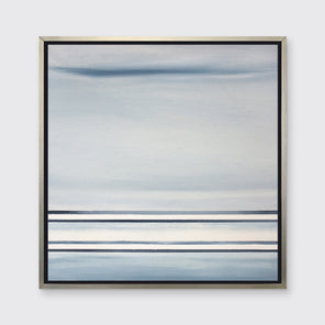 A blue and white linear abstract print in a silver floater frame on a white wall.