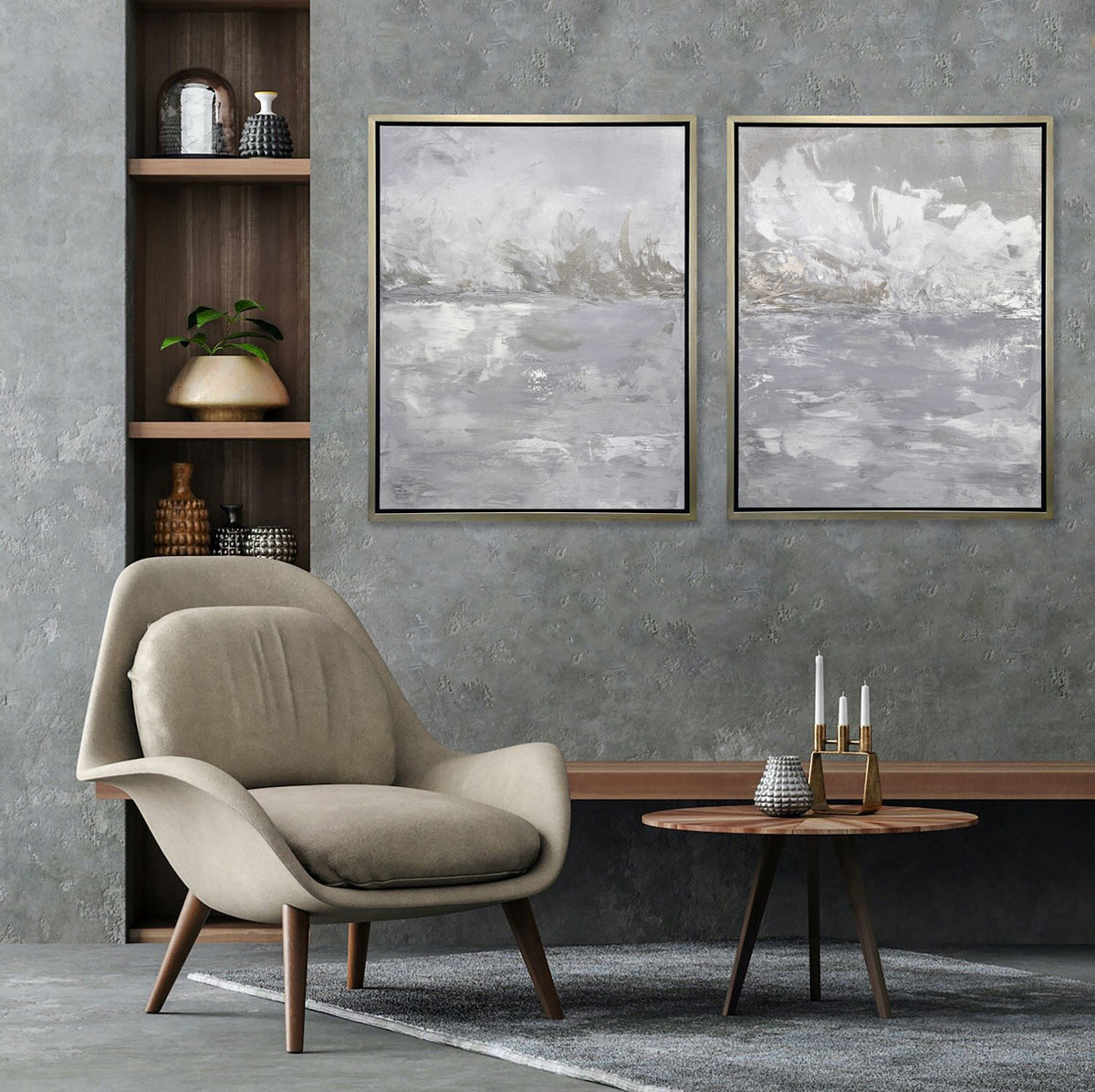 Two grey and white abstract prints hang on a textured grey wall above a mid-century armchair and coffee table.