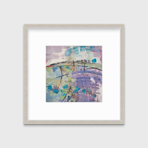 A purple, blue, green and teal abstract print in a silver frame with a mat hangs on a white wall.