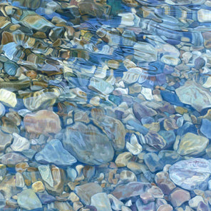 Abstracted river rocks under water, with light blues, yellow, and browns.