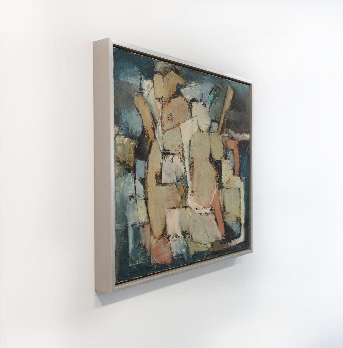 A painting of abstract human forms is seen at an angle. The painting is wired and ready to hang.