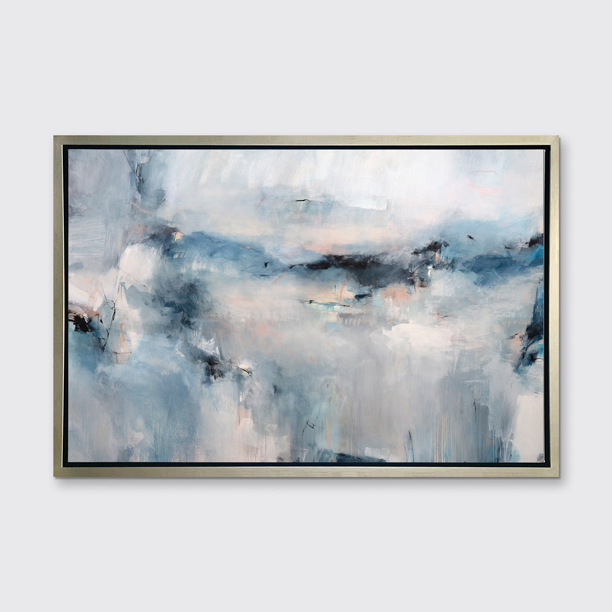 A blue and white abstract print in a silver floater frame hangs on a white wall.