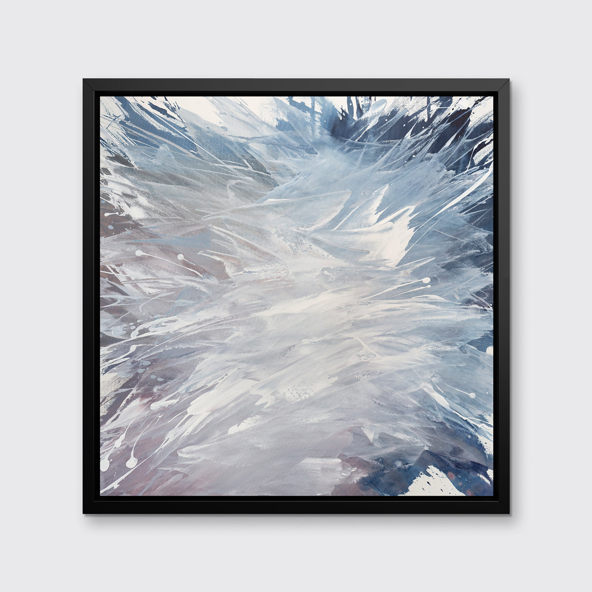 A light purple, grey, white and blue abstract print in a black floater frame hangs on a white wall.