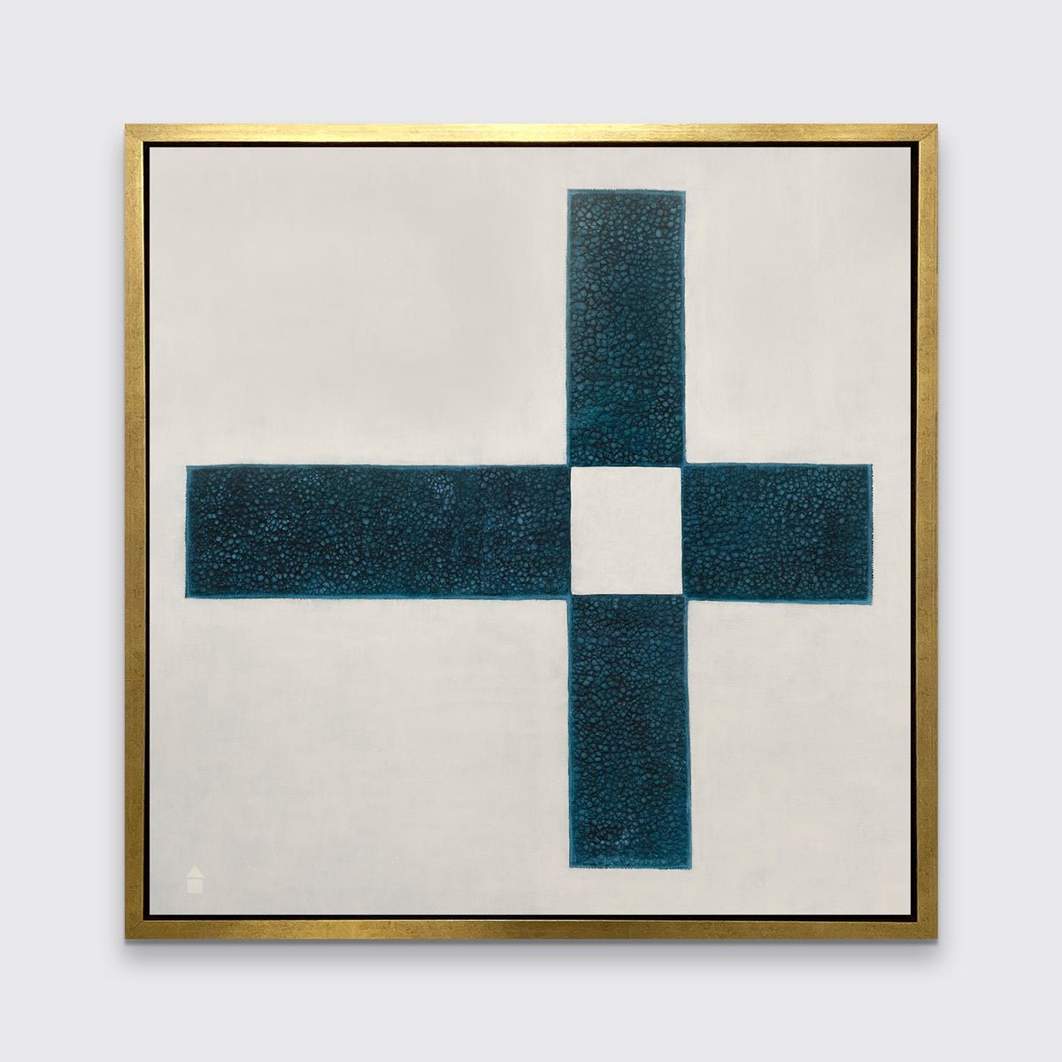 A beige and teal abstract geometric print in a gold floater frame hangs on a white wall.