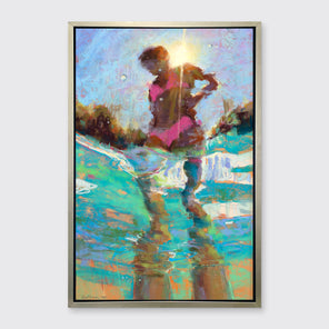An abstract figurative print of a woman in a pink bikini surrounded by teal water in a silver floater frame hangs on a white wall.