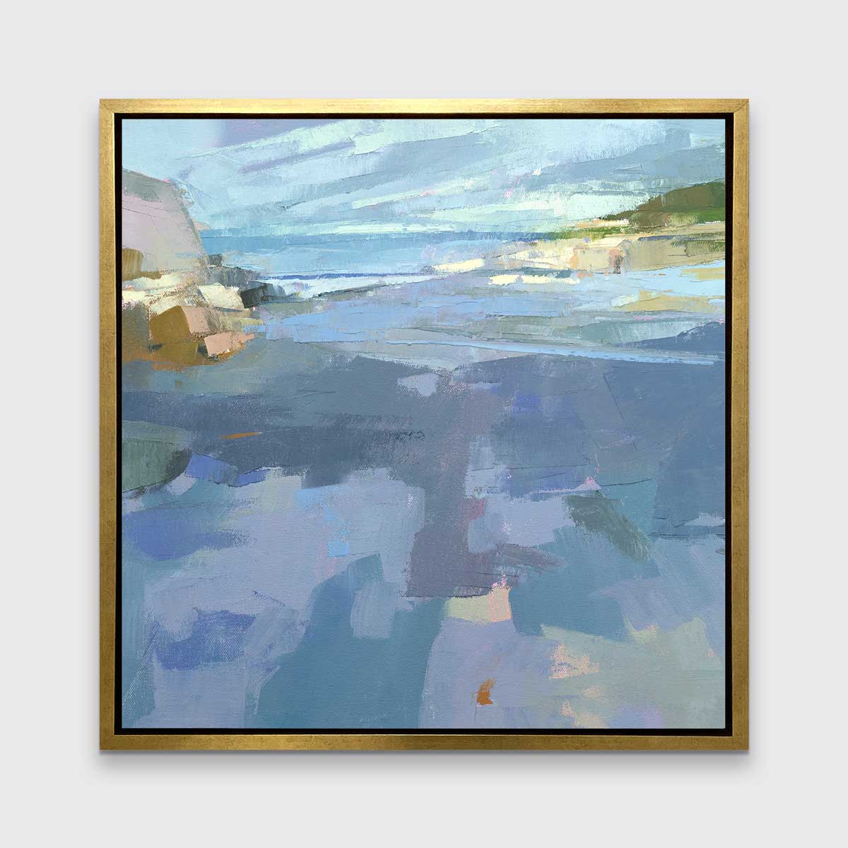 A blue, purple and green abstract landscape print in a gold floater frame hangs on a white wall.