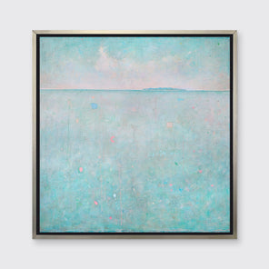 A light blue abstract landscape print in a silver floater frame hangs on a white wall.