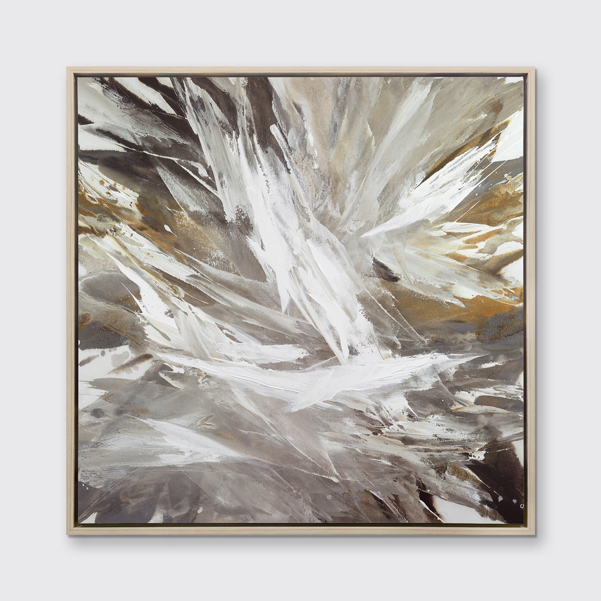A white, grey, dark grey and gold abstract print in a white oak wood floater frame hangs on a white wall.