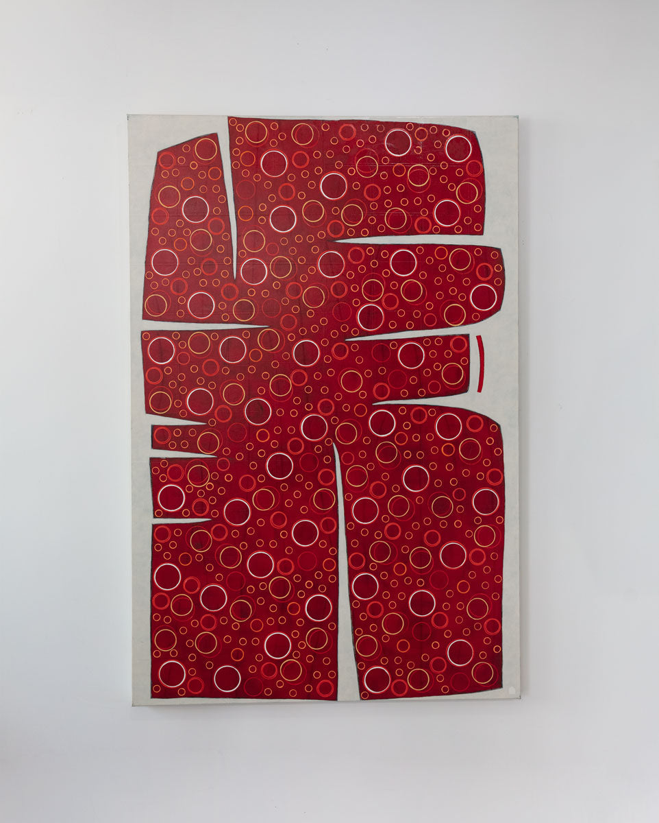 A large abstract painting of an irregular red form containing yellow and white circles is hung on a gallery wall.