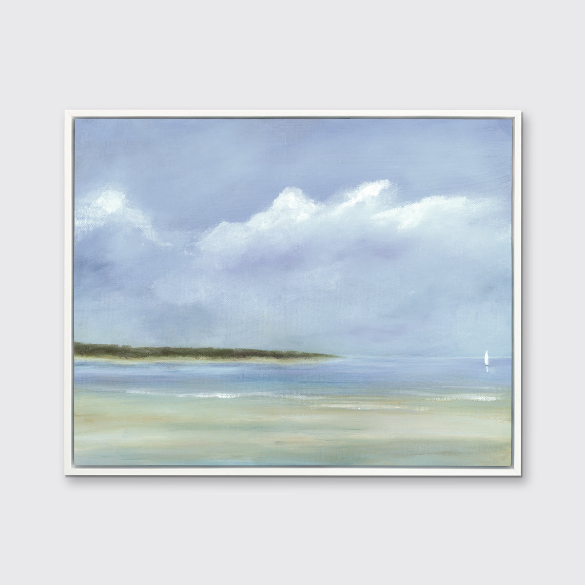 A blue, white and green seascape print in a white floater frame hangs on a white wall.