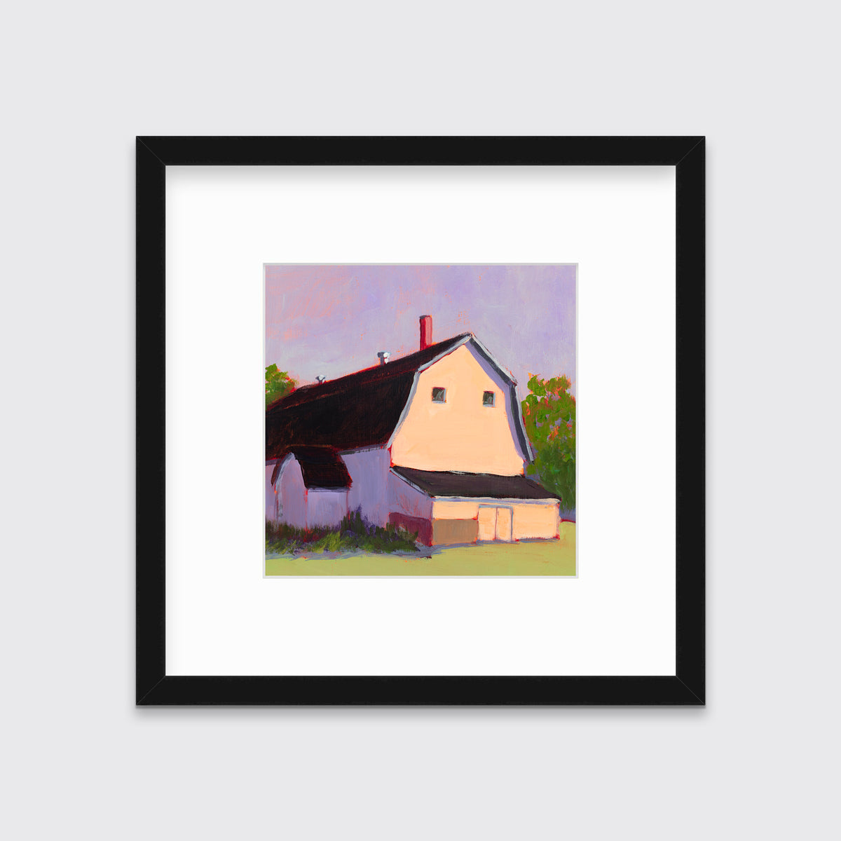 A print of a beige barn, a lavender sky, green bushes and trees and a light green foreground in a black frame with a mat hangs on a white wall.