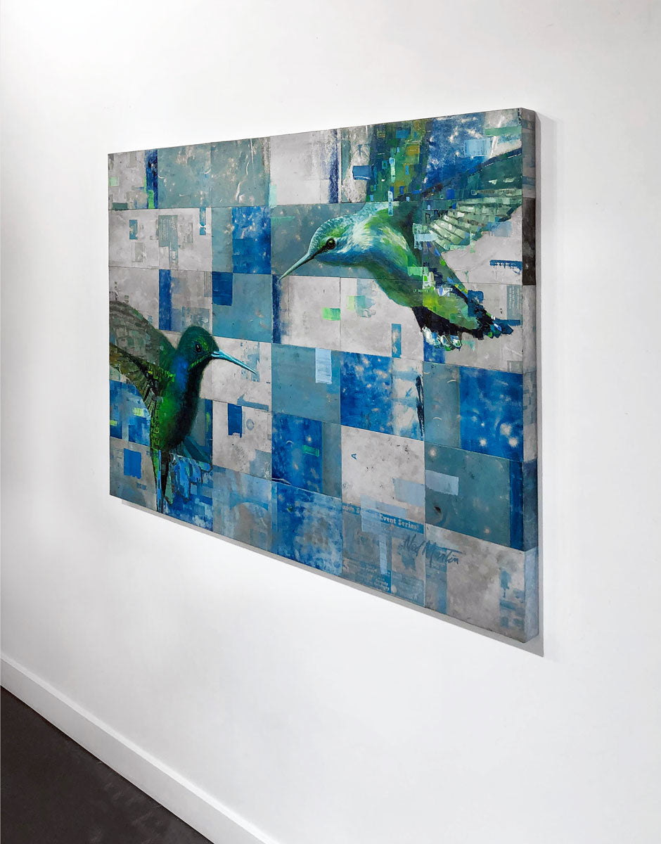 A right-side angle of an abstract painting of two humming birds by Ned Martin, on a white wall.