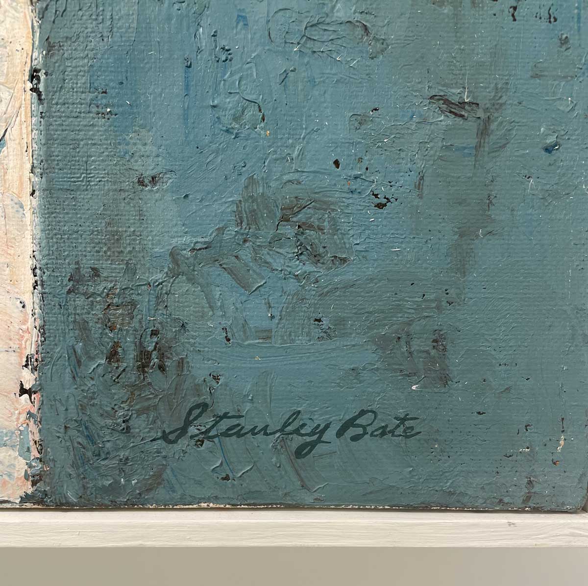 A close up of the artist's signature in the bottom right hand corner.