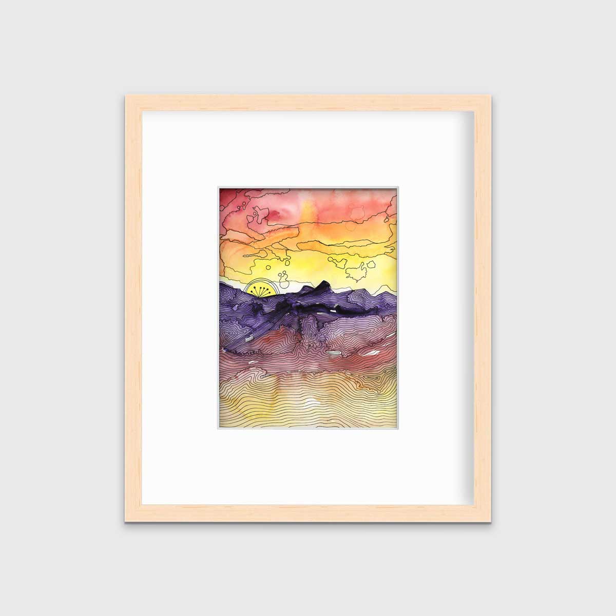A red, orange, yellow, purple and black abstract landscape print in a natural wood frame with a mat hangs on a white wall.