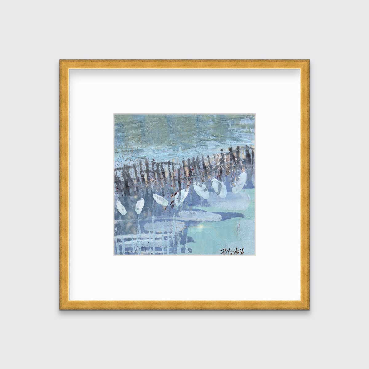 A blue, lavender and olive green abstract print in a gold frame with a mat hangs on a white wall.