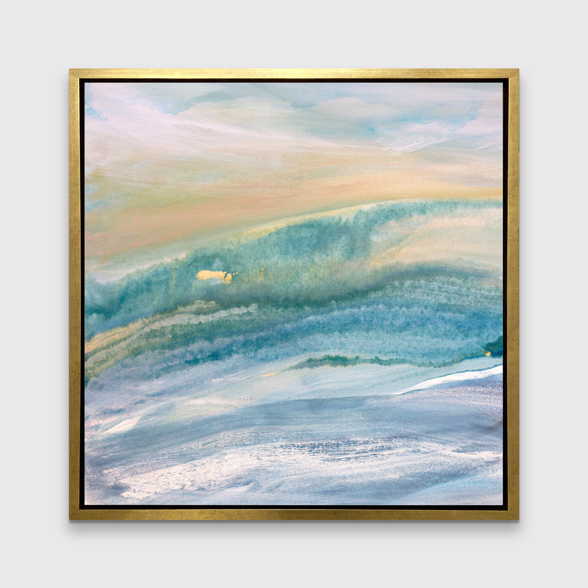 A blue, teal, yellow and white abstract print in a gold floater frame hangs on a white wall.
