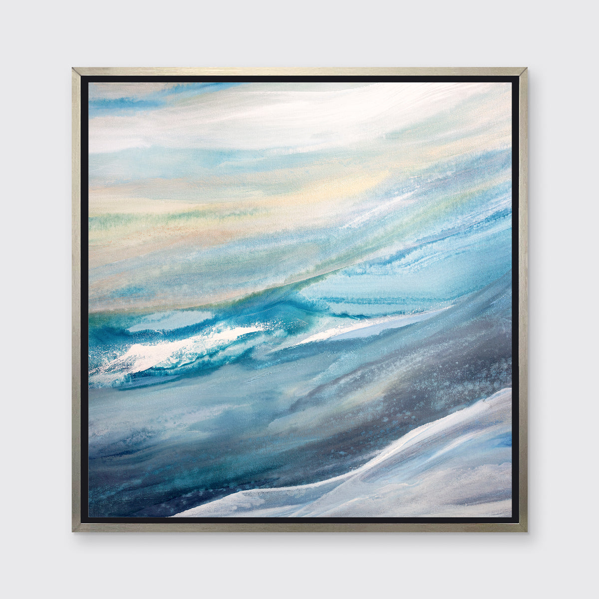 A blue, teal, yellow and white abstract print in a silver floater frame hangs on a white wall.