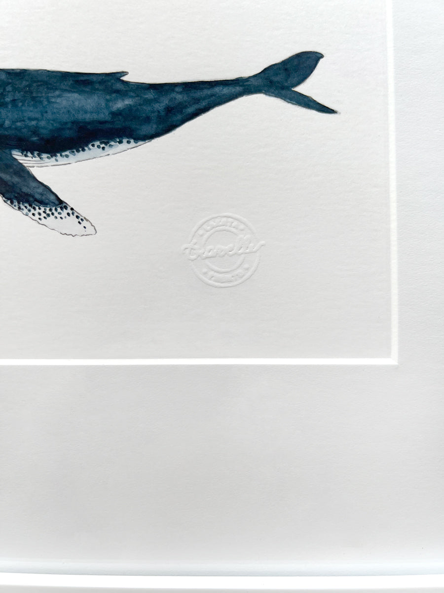 A close up of the back end of the whale and the artist's stamp.