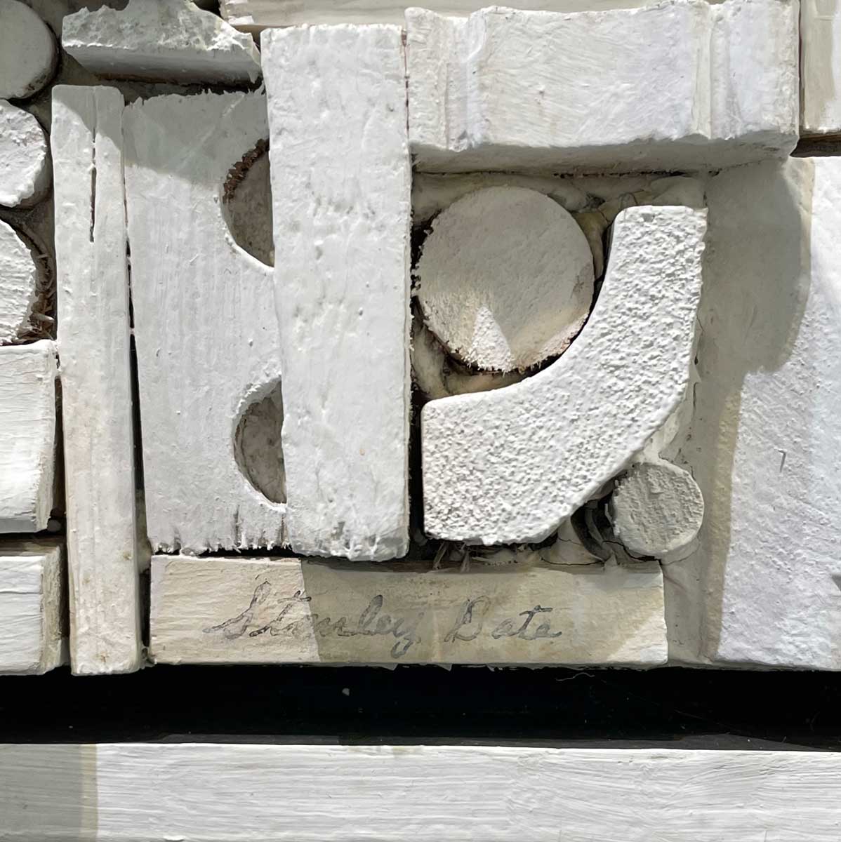 A close up of the artist's signature in the bottom right hand corner.