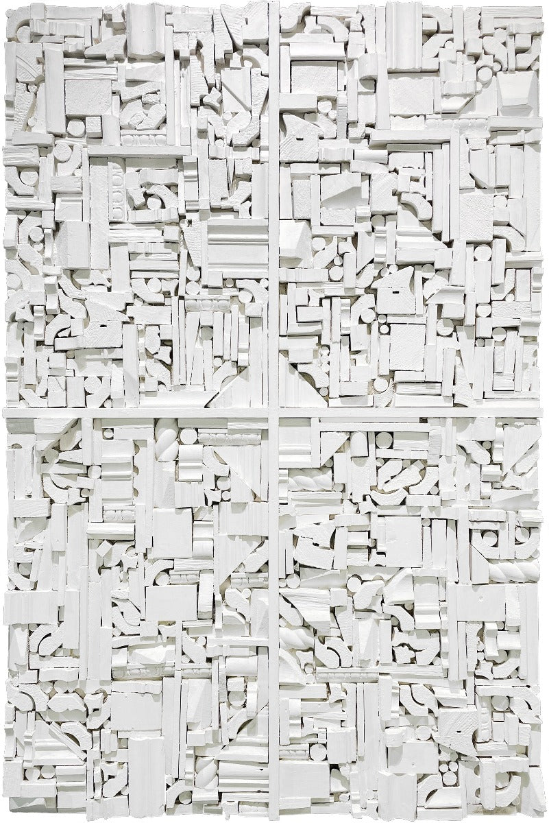 A white painted wood shape sculpture by Stanley Bate.