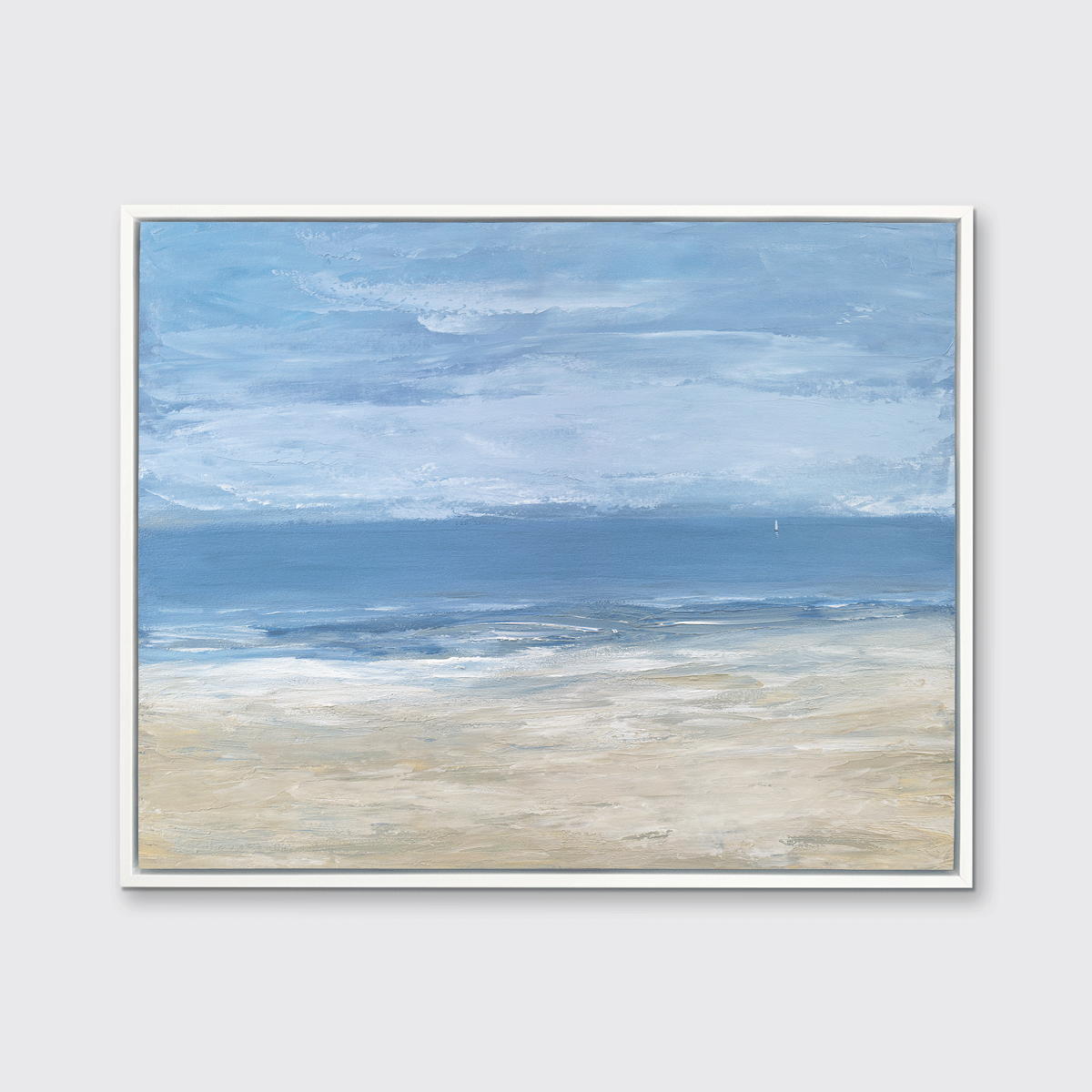 A blue, light blue, white and beige abstract seascape print in a white floater frame hangs on a white wall.