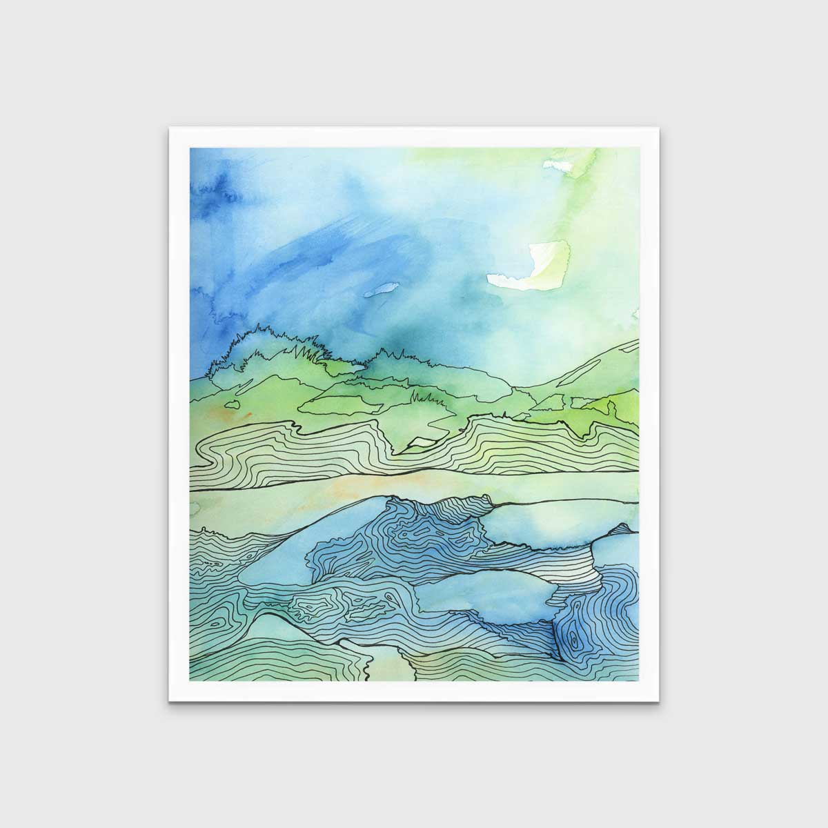 A blue, green and black abstract landscape print in an unmatted white frame hangs on a white wall.