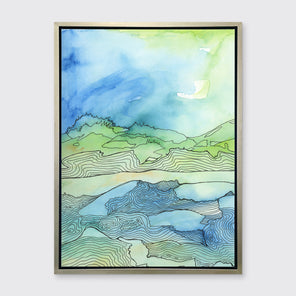 A green and blue abstract landscape illustration print framed in a silver frame hangs on a grey wall.