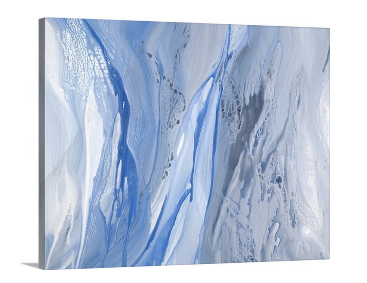 A side-angle view of a blue, white and grey abstract print on canvas.