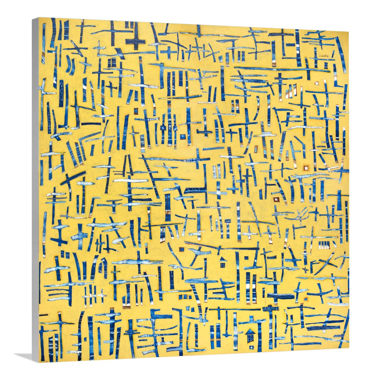 A side-angle view of a yellow, blue and white abstract print on canvas.