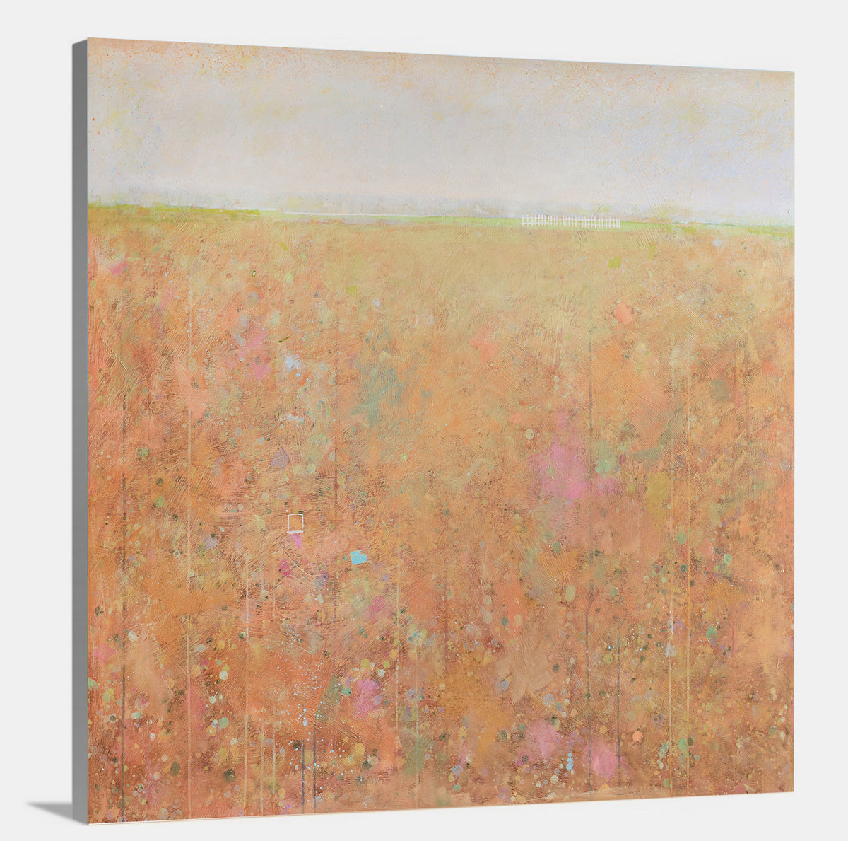 A side-angle view of an orange, light green, light blue and pink abstract landscape print on canvas.
