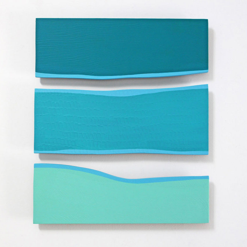 A square-shaped abstract artwork featuring overlapping panels of blue, green, and white colors on a white background.