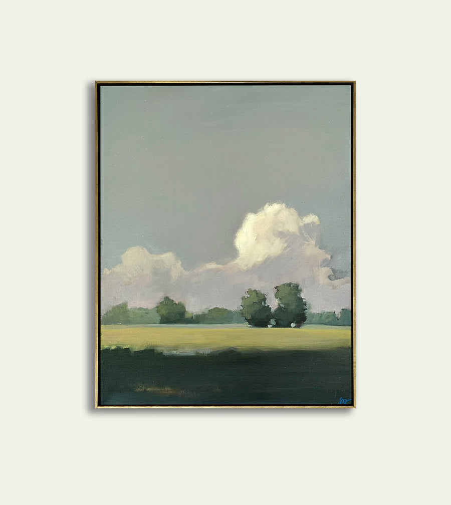 Framed artwork of a landscape with trees and clouds on a light gray background