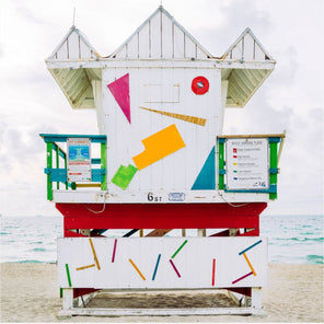 A photograph of a colorful Miami Beach lifeguard stand. 