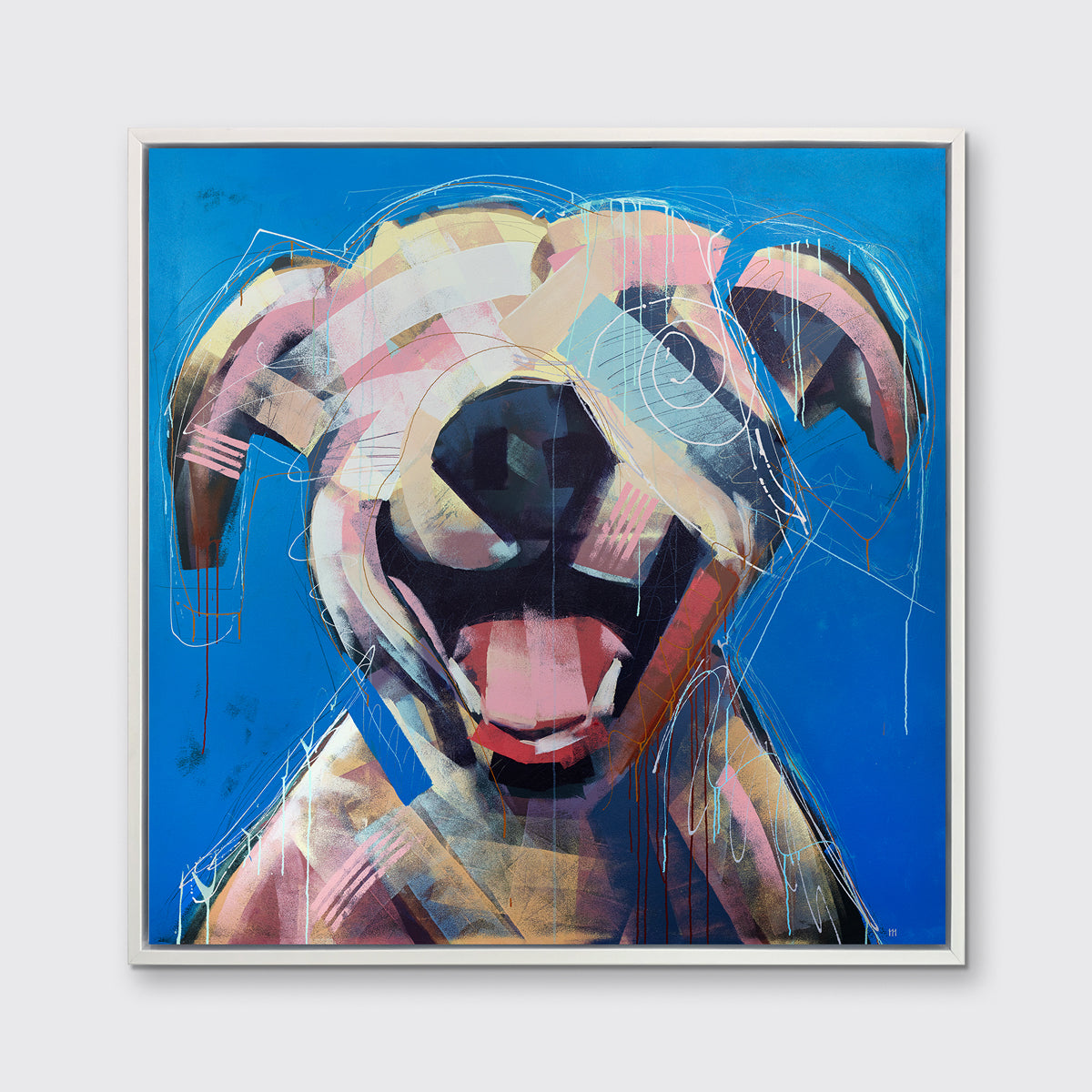 A yellow-orange, pink, red and blue abstract dog print in a white floater frame hangs on a white wall.