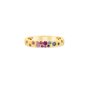 Gold ring with colorful gemstones on a white background