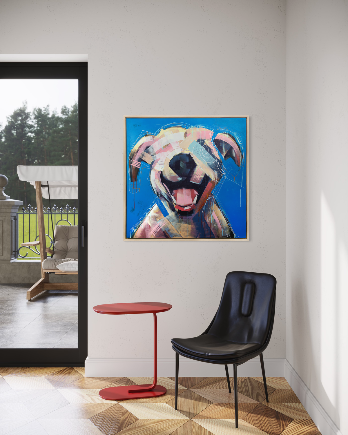A yellow-orange, pink, red and blue abstract dog print in a white oak wood floater frame hangs on a white wall above a black chair and small red side table and next to a sliding glass door to an outside patio.