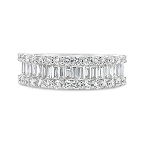 Diamond ring with baguette and round cut stones on a white background