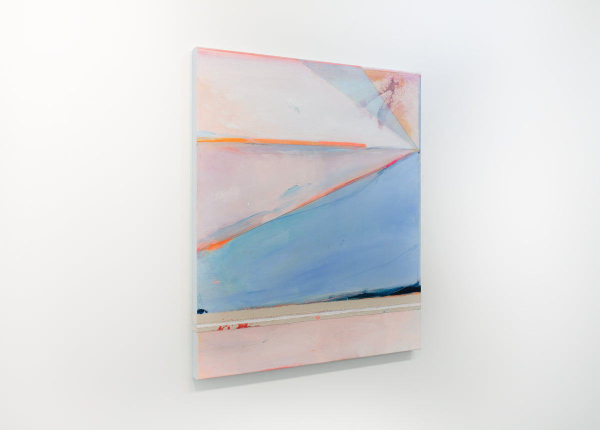 A pink and blue abstract painting hangs on a white wall.