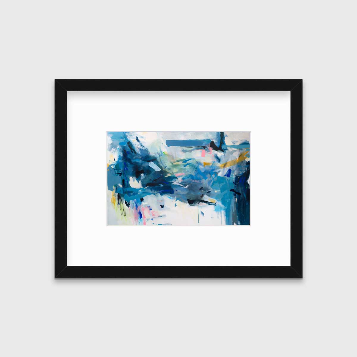 A blue and white abstract print by Kelly Rossetti in a black frame with a mat hangs on a white wall.