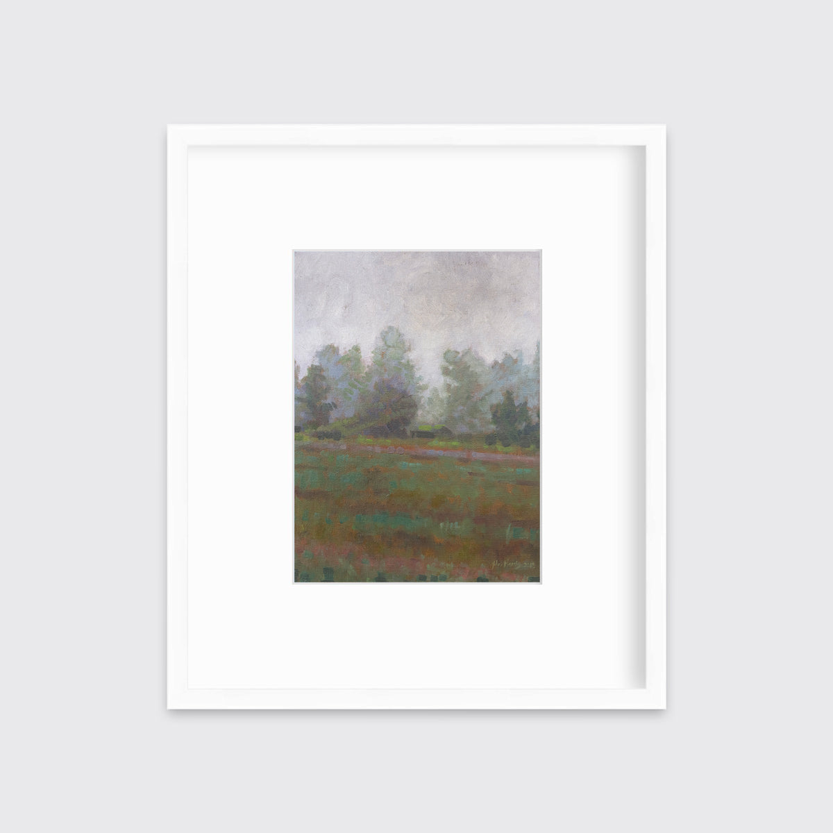 A grey and muted green abstract landscape print in a white frame with a mat hangs on a white wall.
