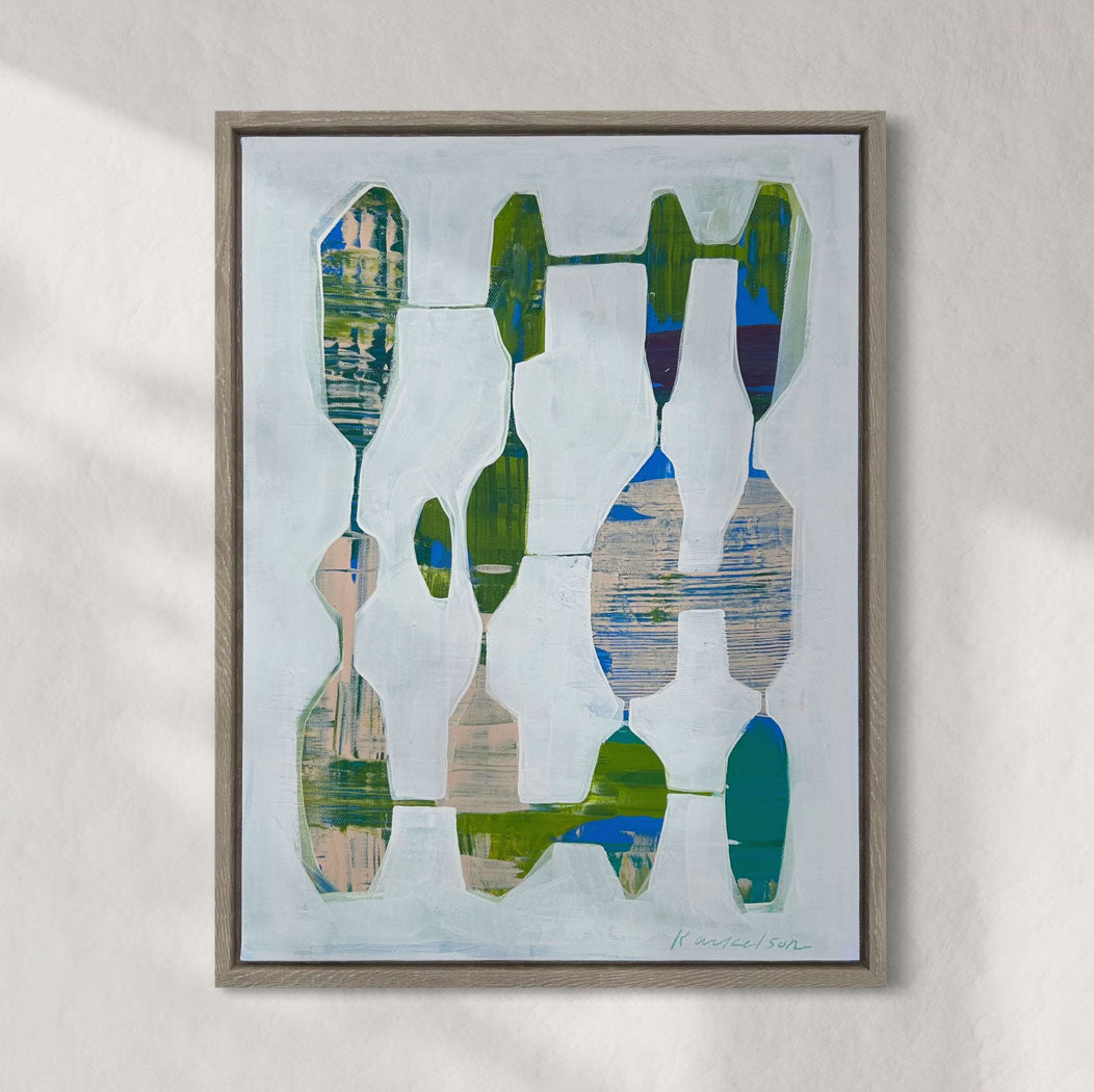 A framed abstract painting featuring geometric shapes in shades of blue, green, beige, and other colors, set against a white background.