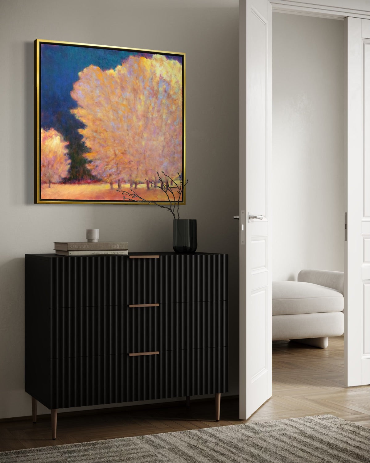 Modern interior with a black cabinet, abstract painting, and white sofa.