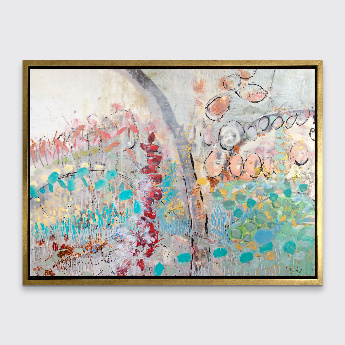 A multicolored abstract floral print in a gold floater frame hangs on a white wall.