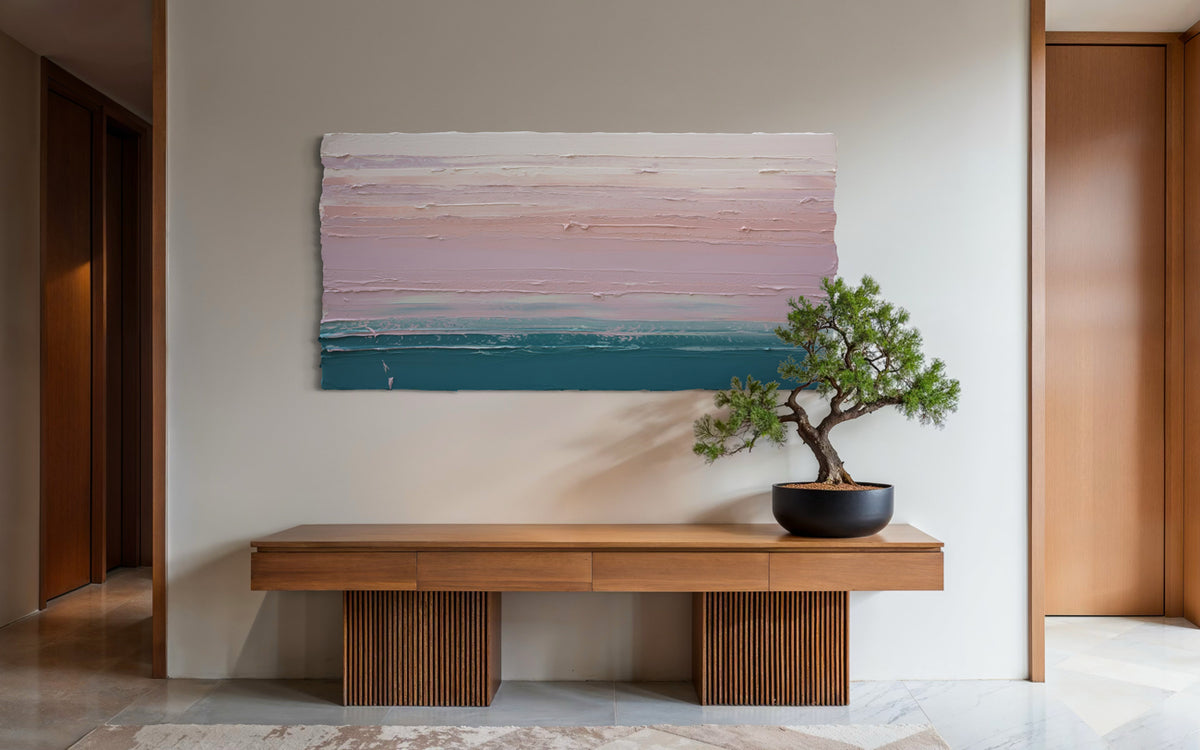 Modern interior with a wooden bench, bonsai tree, and an original abstract painting by Teo Guererra hangs on the wall.