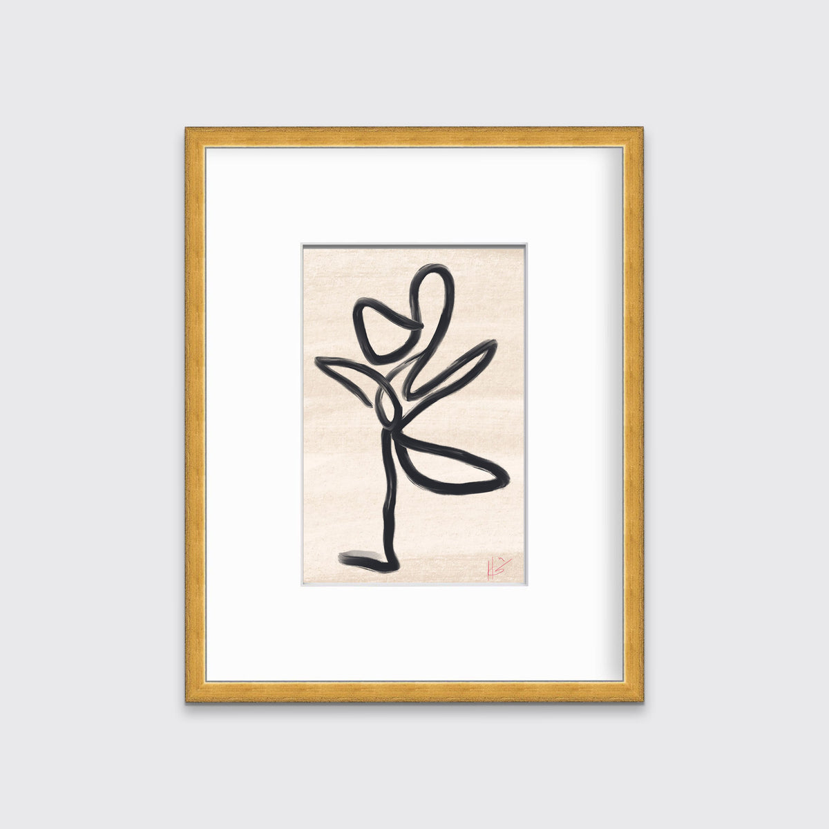 A black and beige abstract print in a gold frame hangs on a light grey wall. 