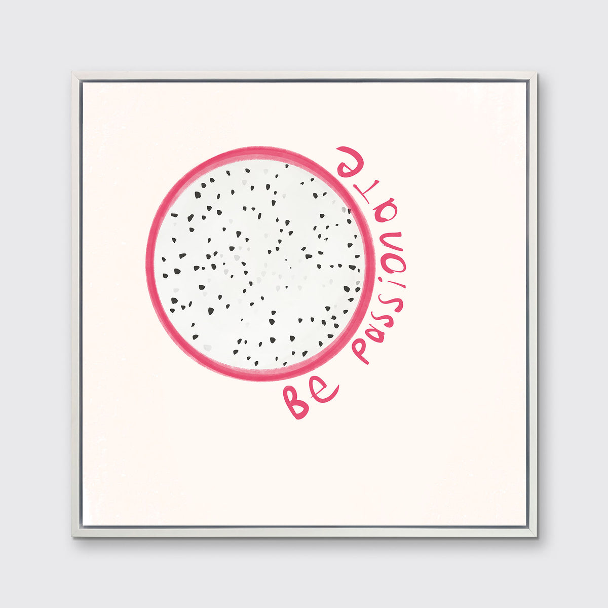 An abstract art print of a fruit framed in a white floater frame hangs on a light wall. 