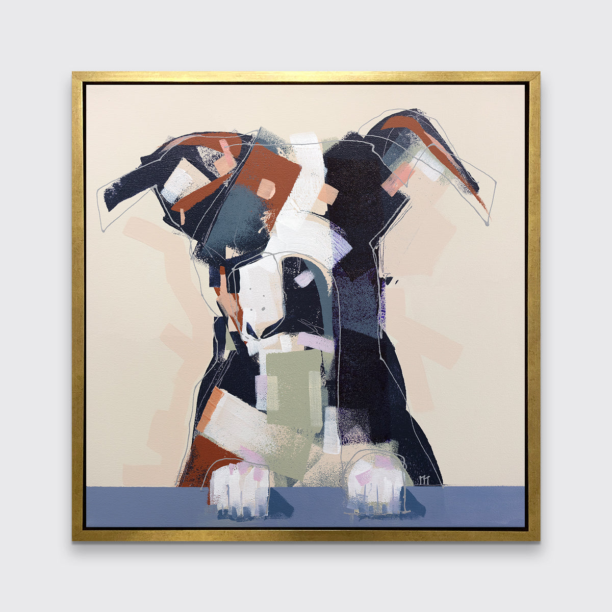 A navy, brown, white and beige abstract dog print in a gold floater frame hangs on a white wall.