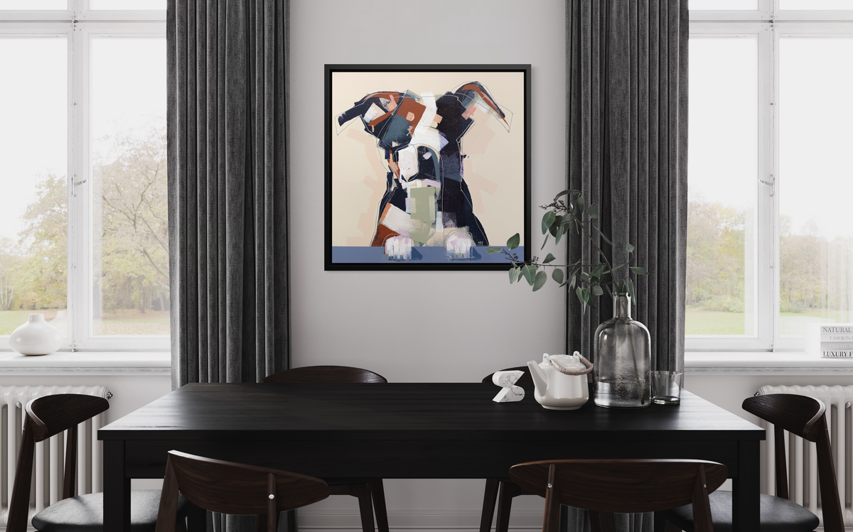 A navy, brown, white and beige abstract dog print in a black floater frame hangs on a white wall in between two windows with grey curtains and above a black table with six low back brown chairs. 